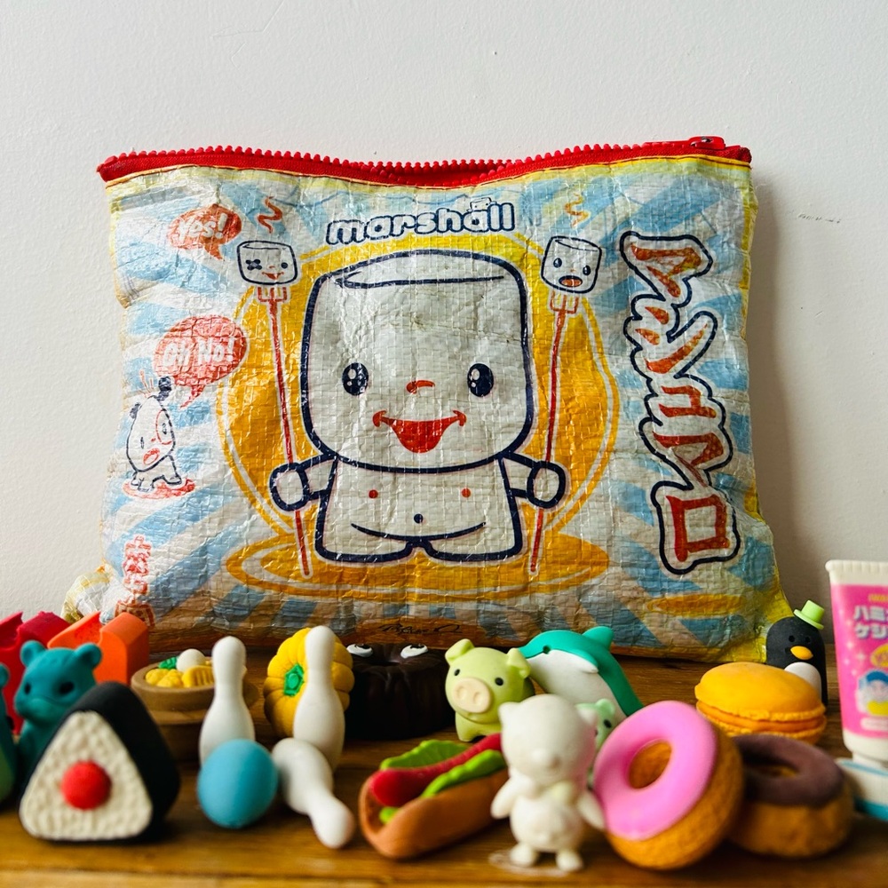 56 Rotofugi take apart erasers + 3 figures with branded zip up bag